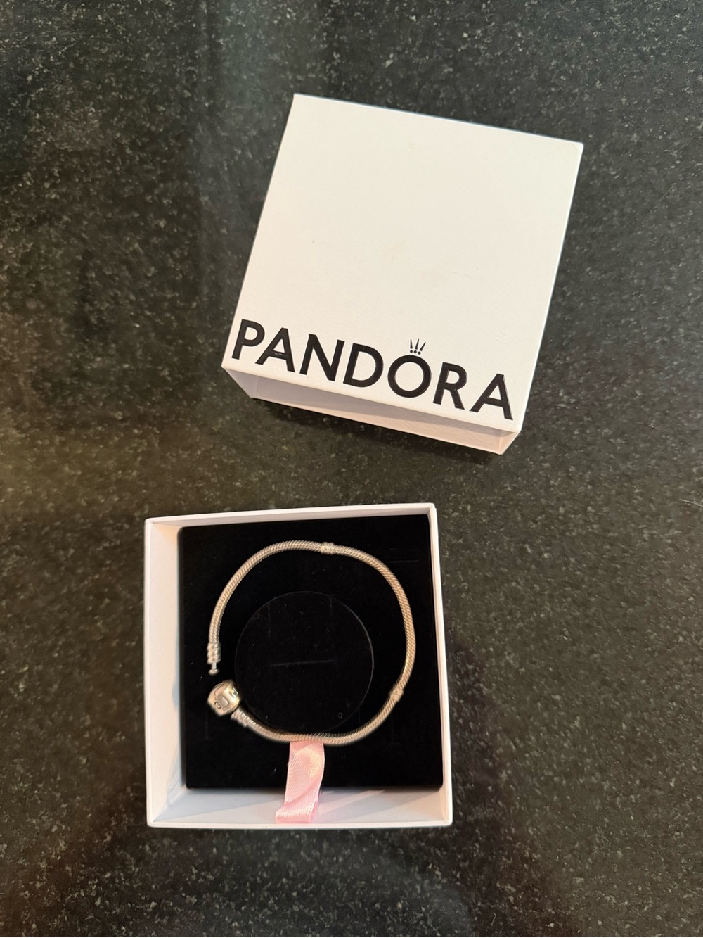 Authentic Pandora sterling silver charm bracelet in excellent pre-owned cond.